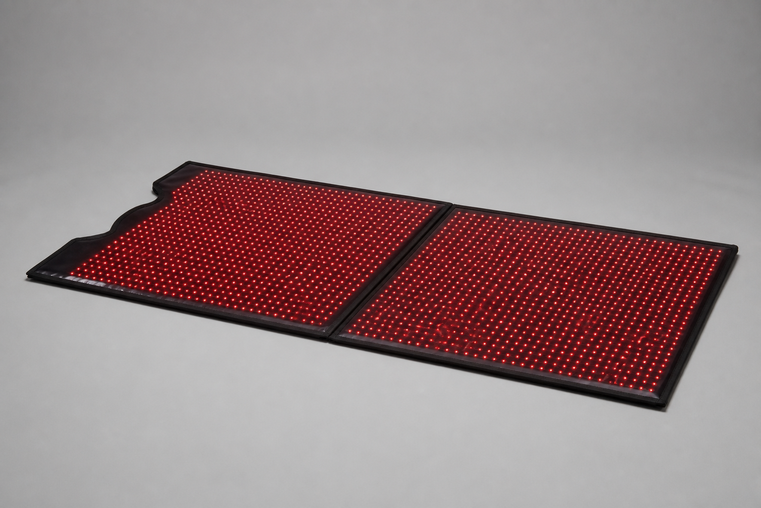 Megelin red light therapy bag opened to show its illuminated inner panels