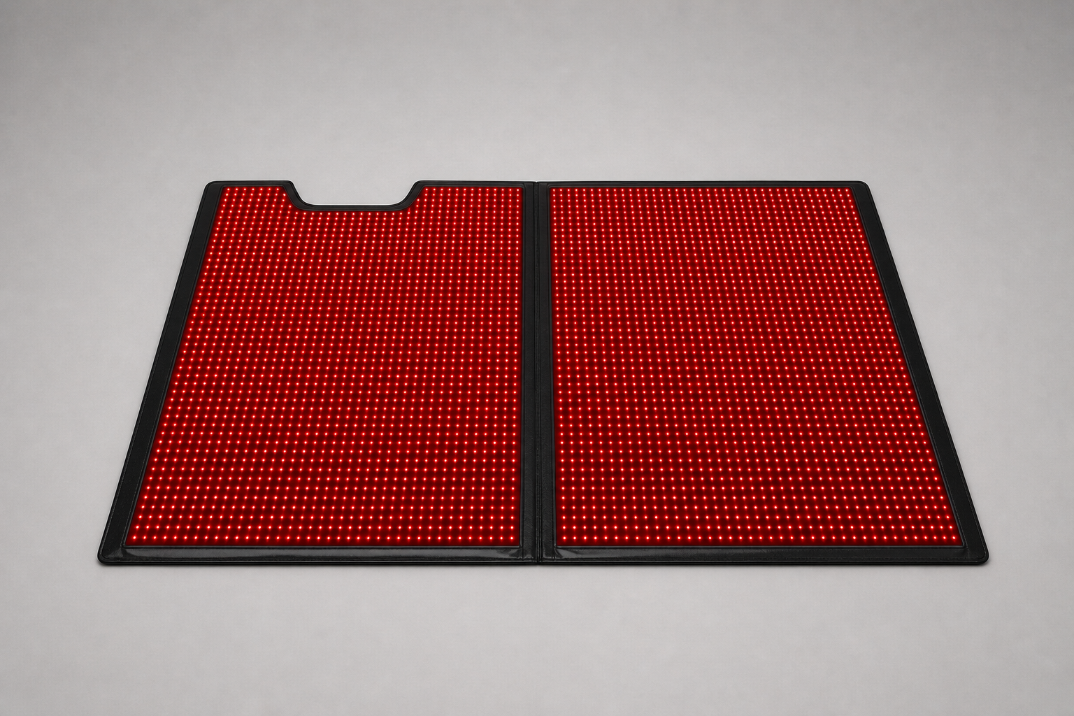 Nuvio red light therapy bag opened beside its controller and accessories