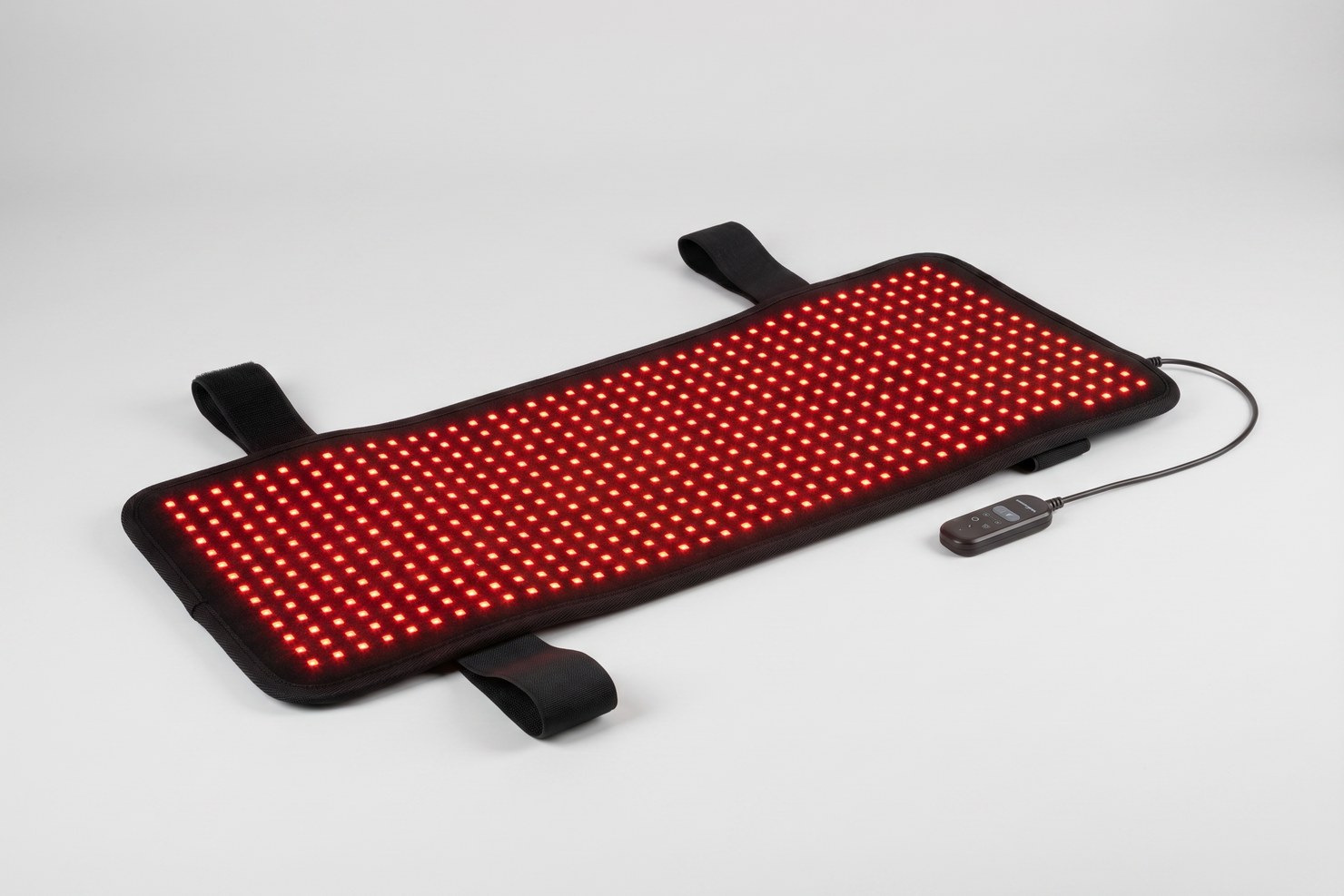 The full NiceBeam Ultra Pad laid flat with its straps and every LED glowing